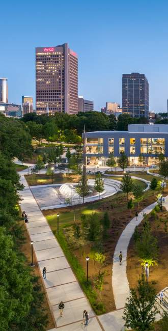gt campus at dusk with the city in the background