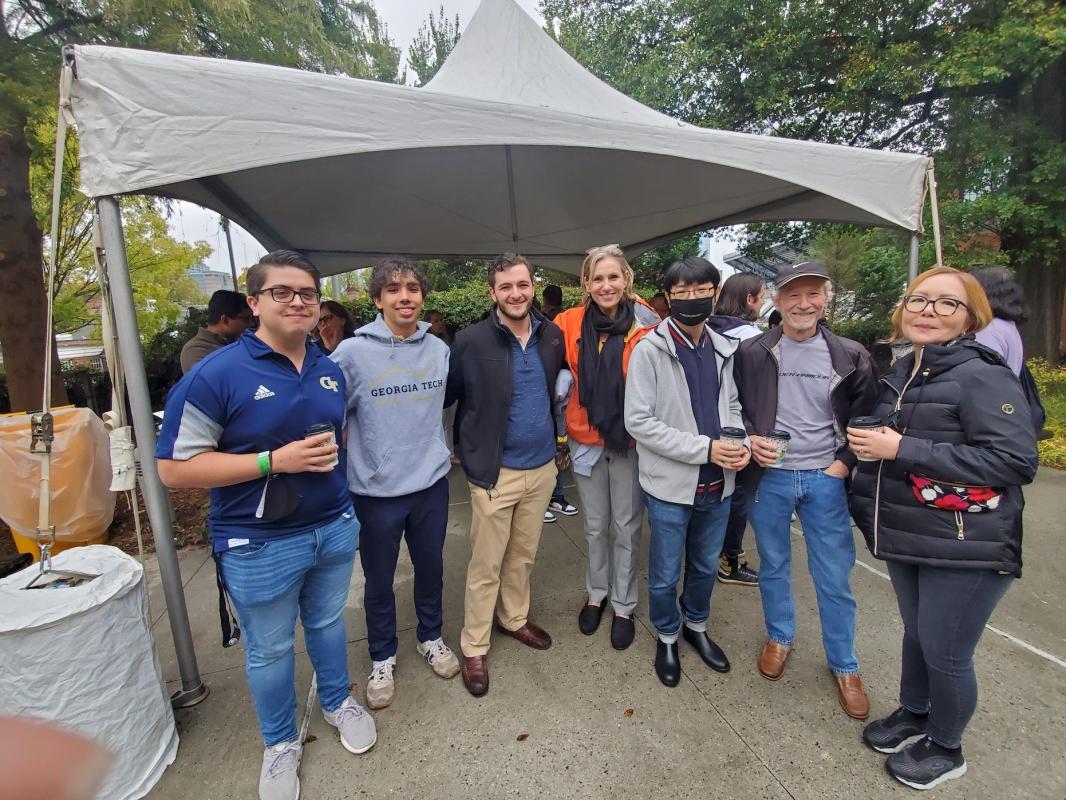 Faculty and students at the alumni homecoming tailgate